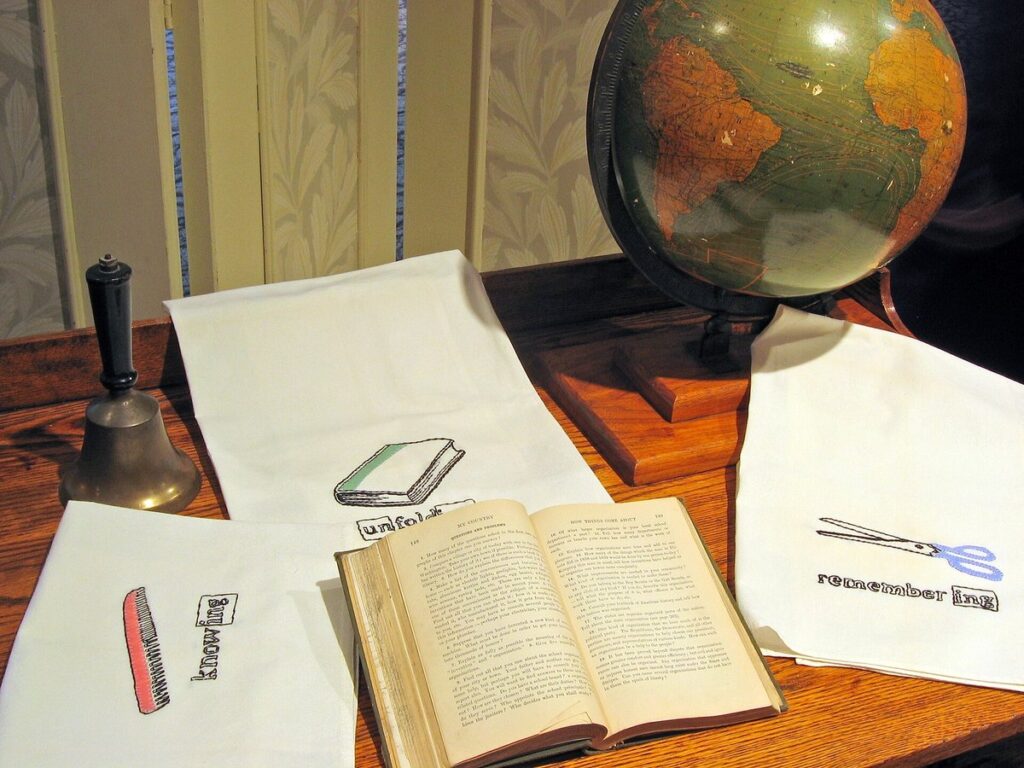 Globe and desk - needlework on display at Stevens County Museum